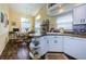 Bright kitchen featuring ample counter space, sink, and open to the breakfast area at 9636 Brookdale Dr, New Port Richey, FL 34655