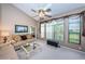 Cozy living room with plush seating, ample natural light, and neutral decor at 9636 Brookdale Dr, New Port Richey, FL 34655
