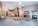 Open-concept living room flowing into the dining area, bathed in natural light at 9636 Brookdale Dr, New Port Richey, FL 34655