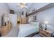 Spacious main bedroom with ensuite bathroom and dual mirrored dresser, featuring neutral decor and soft lighting at 9636 Brookdale Dr, New Port Richey, FL 34655