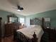 This bedroom has wood floors, natural light, and traditional furnishings at 10619 Mira Vista Dr, Port Richey, FL 34668