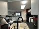 Bright and modern kitchen with black appliances, stylish lighting, and an open layout at 10619 Mira Vista Dr, Port Richey, FL 34668