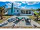 Well-maintained backyard with patio, lounge chairs, and dining set for outdoor enjoyment at 1074 Woodbrook S Dr, Largo, FL 33770