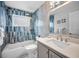 Beautifully renovated bathroom with stylish tile work, modern fixtures, and a tub-shower combination at 1074 Woodbrook S Dr, Largo, FL 33770