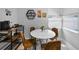 Cozy breakfast nook with seating for four, natural light, and stylish decor at 1074 Woodbrook S Dr, Largo, FL 33770