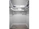 Walk-in closet offering ample shelving and storage space at 1074 Woodbrook S Dr, Largo, FL 33770