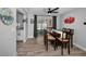 Inviting dining room with wood table and chairs, neutral paint, and view of backyard at 1074 Woodbrook S Dr, Largo, FL 33770