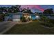 Charming blue single story home with landscaped yard and stone accents at 1074 Woodbrook S Dr, Largo, FL 33770