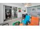 Open Florida room features tile flooring, access to the backyard, and views of the main house at 1074 Woodbrook S Dr, Largo, FL 33770