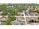 Wide aerial shot outlines property lines in a verdant locale; house has pool and outbuilding at 11379 Flower Ave, Weeki Wachee, FL 34613