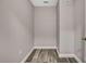 Walk-in closet with neutral paint and wood-look flooring at 11379 Flower Ave, Weeki Wachee, FL 34613