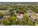 Aerial view of the property highlighting its location surrounded by lush greenery at 1156 Battersea Ave, Spring Hill, FL 34609