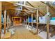 Spacious attic featuring exposed wooden beams and ample storage space, perfect for organization or future expansion at 1156 Battersea Ave, Spring Hill, FL 34609