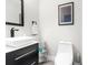 Bathroom featuring modern fixtures, including a sink and a toilet at 1156 Battersea Ave, Spring Hill, FL 34609