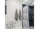Close-up of the walk-in shower with black tile and glass shower door at 1156 Battersea Ave, Spring Hill, FL 34609