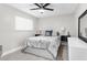 Cozy bedroom with queen-sized bed, modern nightstands, and neutral decor at 1156 Battersea Ave, Spring Hill, FL 34609