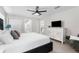 Bedroom with closet, white dresser, and views of the bathroom and laundry room at 1156 Battersea Ave, Spring Hill, FL 34609