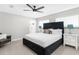 Light and airy bedroom with neutral colors and modern furniture at 1156 Battersea Ave, Spring Hill, FL 34609