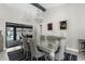 Dining room featuring modern chandelier and view to pool area at 1156 Battersea Ave, Spring Hill, FL 34609