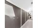 Hallway features lots of closet space and a view of a bedroom in the distance at 1156 Battersea Ave, Spring Hill, FL 34609