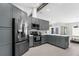 Spacious kitchen with stainless steel appliances, and tiled floors at 1156 Battersea Ave, Spring Hill, FL 34609