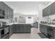Kitchen with stainless steel appliances, and views to the adjacent living room at 1156 Battersea Ave, Spring Hill, FL 34609