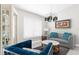 Bright living room featuring modern decor, chandelier, and elegant furniture set at 1156 Battersea Ave, Spring Hill, FL 34609