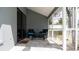 View of covered patio with outdoor seating and a view of the backyard at 1156 Battersea Ave, Spring Hill, FL 34609