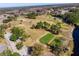 An aerial view of the community golf course with mature trees and landscaping at 12037 Boynton Ln, New Port Richey, FL 34654