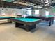 This bright billiard room has multiple tables under modern lighting at 12037 Boynton Ln, New Port Richey, FL 34654