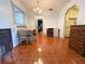Bright dining area with tiled floors, a dining set, and sliding door at 12037 Boynton Ln, New Port Richey, FL 34654