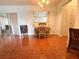 Bright dining area with tiled floors, a dining set, and sliding door at 12037 Boynton Ln, New Port Richey, FL 34654