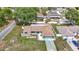 Charming single-story home featuring a well-manicured lawn and an attached two-car garage at 12087 Tallwood St, Spring Hill, FL 34608