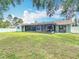 Spacious backyard featuring a screen patio at 12087 Tallwood St, Spring Hill, FL 34608