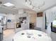 Cozy breakfast nook with overhead lighting adjacent to the stainless steel kitchen appliances at 12087 Tallwood St, Spring Hill, FL 34608