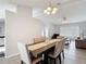 Open dining area featuring a wood table with six chairs and easy access to the entry way at 12087 Tallwood St, Spring Hill, FL 34608