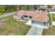 Charming single-story home featuring a well-manicured lawn and an attached two-car garage at 12087 Tallwood St, Spring Hill, FL 34608