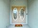 Inviting front entrance with double doors, decorative wreath, and a 'Home Sweet Home' doormat at 12087 Tallwood St, Spring Hill, FL 34608