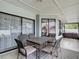 Relaxing outdoor patio with comfortable seating and views of the backyard at 12087 Tallwood St, Spring Hill, FL 34608