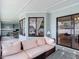 Inviting outdoor living space with comfortable seating and seamless access to indoor and outdoor areas at 12087 Tallwood St, Spring Hill, FL 34608