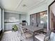 Outdoor patio featuring a dining area with a grill and backyard views at 12087 Tallwood St, Spring Hill, FL 34608