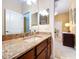 Bathroom featuring wood cabinets, granite countertops, and a sink at 1218 Castle Ter, Tarpon Springs, FL 34689