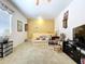 Comfortable bedroom with soft carpet, neutral walls, and comfortable seating at 1218 Castle Ter, Tarpon Springs, FL 34689