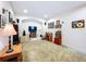 Versatile bonus room featuring carpet, a large TV, and ample space at 1218 Castle Ter, Tarpon Springs, FL 34689