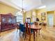 Elegant dining room featuring hardwood floors and a classic chandelier at 1218 Castle Ter, Tarpon Springs, FL 34689