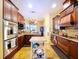Spacious kitchen with ample counter space, stainless steel appliances, and custom cabinetry at 1218 Castle Ter, Tarpon Springs, FL 34689