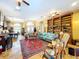 Open-concept living room showcasing tile floors, ample seating, and large windows for abundant natural light at 1218 Castle Ter, Tarpon Springs, FL 34689