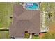 Bird's-eye view of a house with a fenced-in yard and lanai with pool at 12300 Drake Ln, Spring Hill, FL 34609