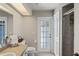 Bathroom with a single sink vanity, toilet, and shower featuring a frosted glass door at 12300 Drake Ln, Spring Hill, FL 34609