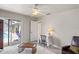 Well-lit bedroom with ceiling fan, and a sliding glass door to the outdoor pool area at 12300 Drake Ln, Spring Hill, FL 34609